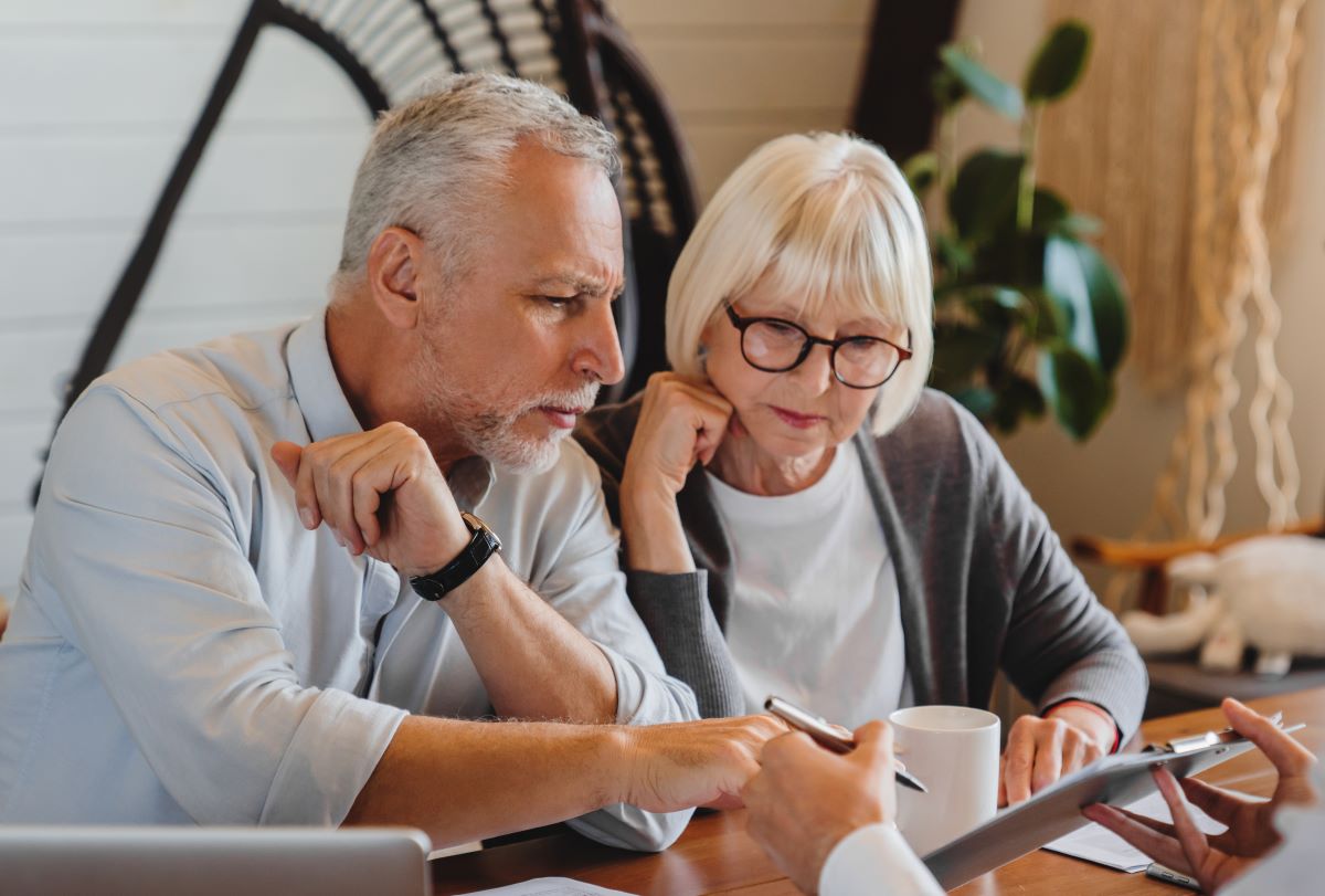 Senior couple in a meeting with their advisor