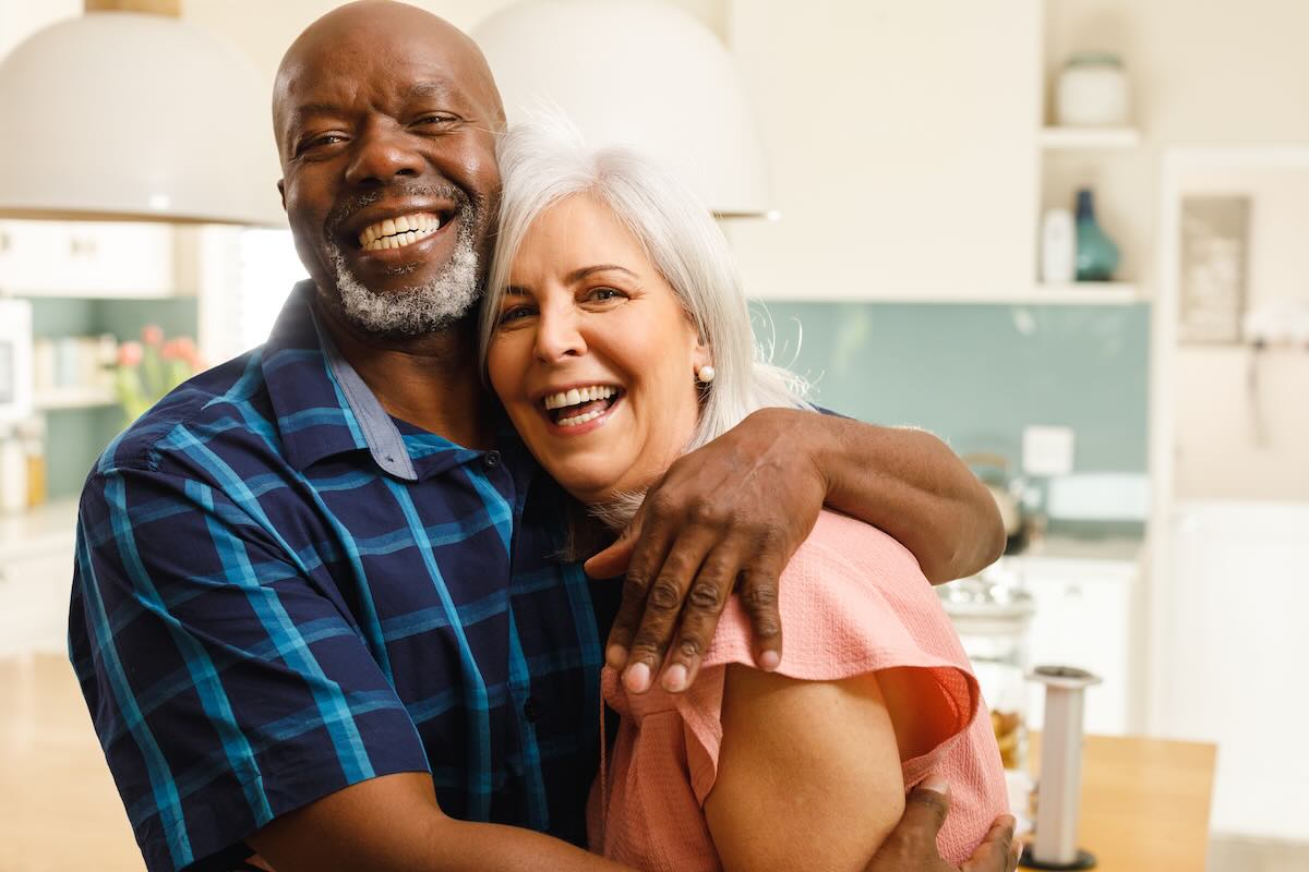 Portrait of happy diverse couple embracing